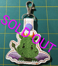 Load image into Gallery viewer, Green Baby Dragon Eyelet And Snap Tab machine embroidery design