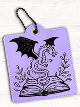 Load image into Gallery viewer, Fantasy Book And Dragon Snap Tab Eyelet Bookmark Machine Embroidery Design
