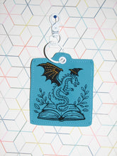 Load image into Gallery viewer, Fantasy Book And Dragon Snap Tab Eyelet Bookmark Machine Embroidery Design