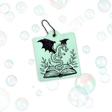 Load image into Gallery viewer, Fantasy Book And Dragon Snap Tab Eyelet Bookmark Machine Embroidery Design