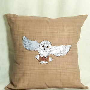 White post owl with letter machine embroidery design on the pillow